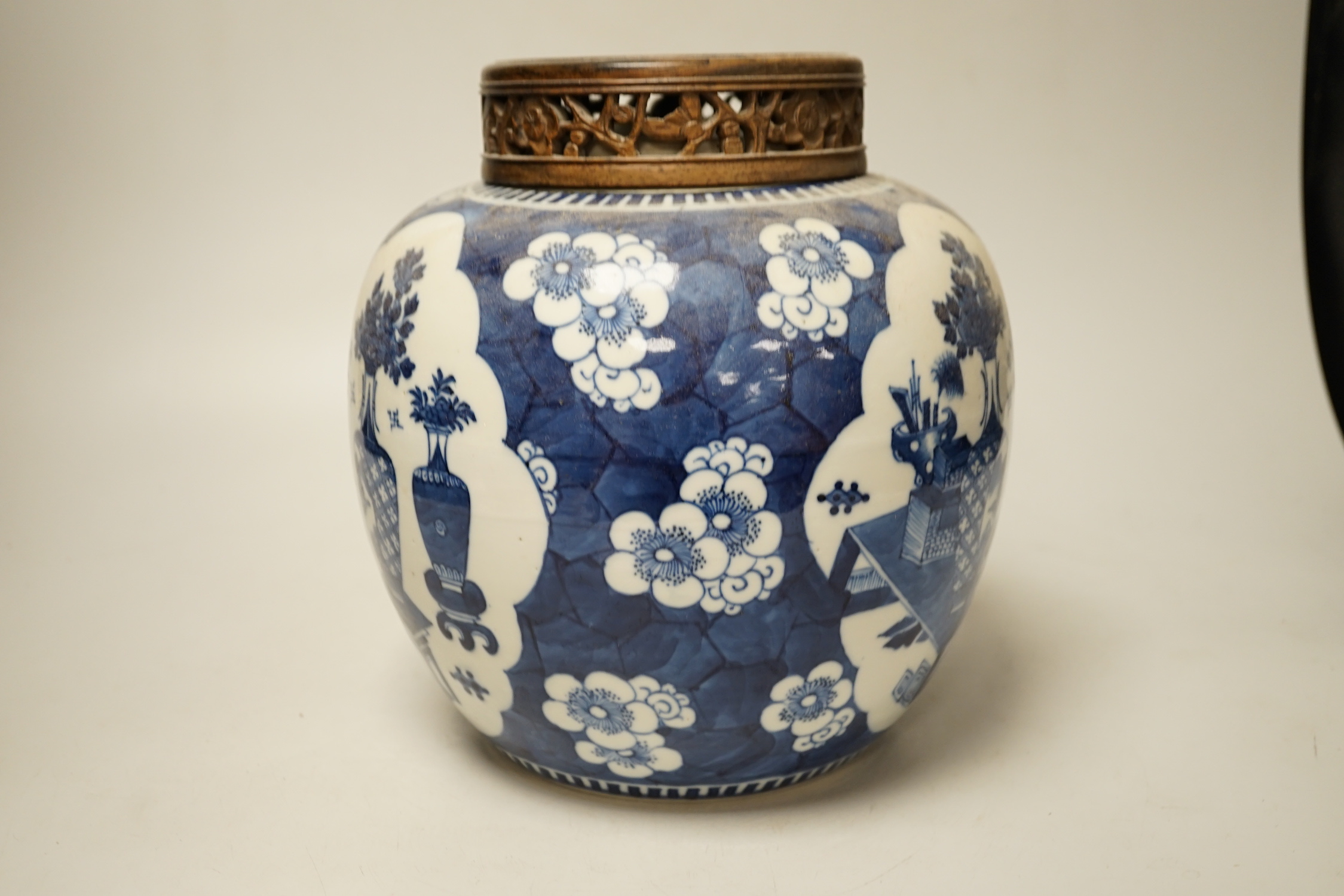 A 19th century Chinese blue and white prunus jar and carved wood cover, 24cm